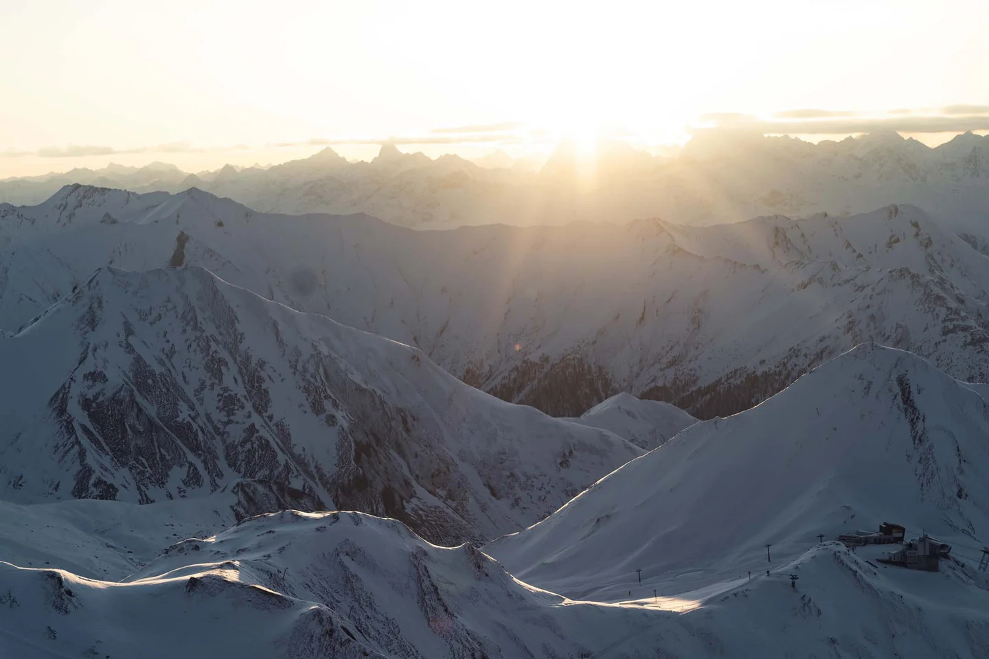 Ferienglück and Alpenland | Your stylish hotels in Ischgl Snow-covered mountain landscape at sunset with a vast alpine panorama
